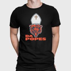A man wearing a black shirt with a football on it.