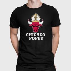 A man wearing a black shirt that says chicago popes.