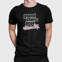 A man wearing a black shirt that says grand theft pope vatican city.
