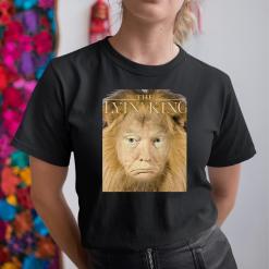 A woman wearing a black shirt with a picture of a lion on it.