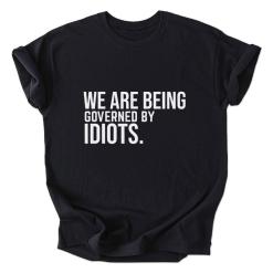 A black shirt that says we are being governed by idiots