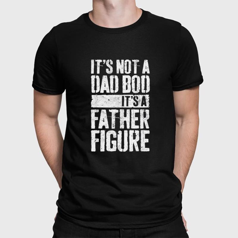 A man wearing a black shirt that says it's not a dad bod, it's a father figure.