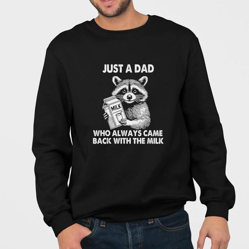 A man wearing a black sweatshirt that says just a dad who always came back with the milk