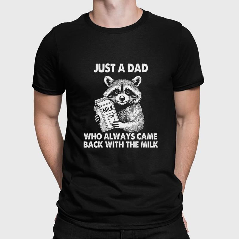 A man wearing a black shirt that says just a dad who always came back with the milk.