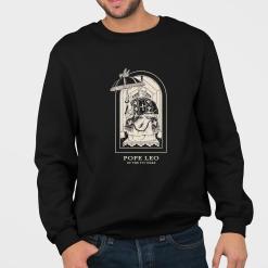 A man wearing a black sweatshirt that says pope leo of the 7th ward.