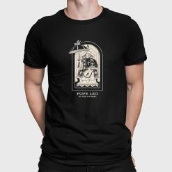 A man wearing a black shirt with a picture of Pope Leo on it.