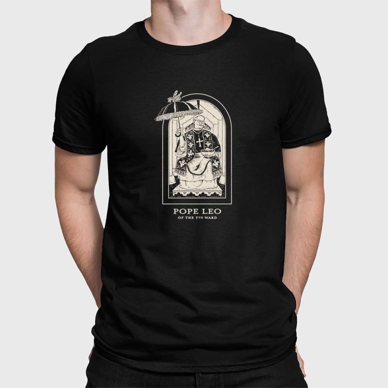 A man wearing a black shirt with a picture of pope leo on it.