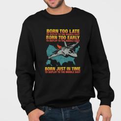 A man wearing a black sweatshirt that says born too late to deploy to the middle east