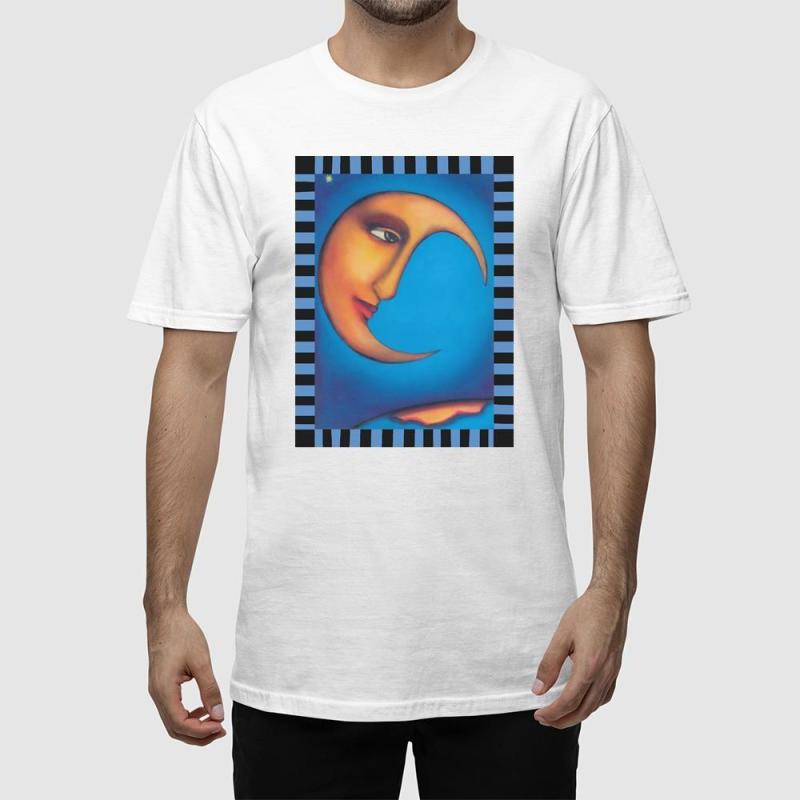 A man wearing a white t-shirt with a painting of a crescent moon.