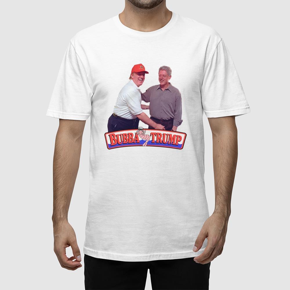 A man wearing a white shirt with a picture of two men shaking hands.