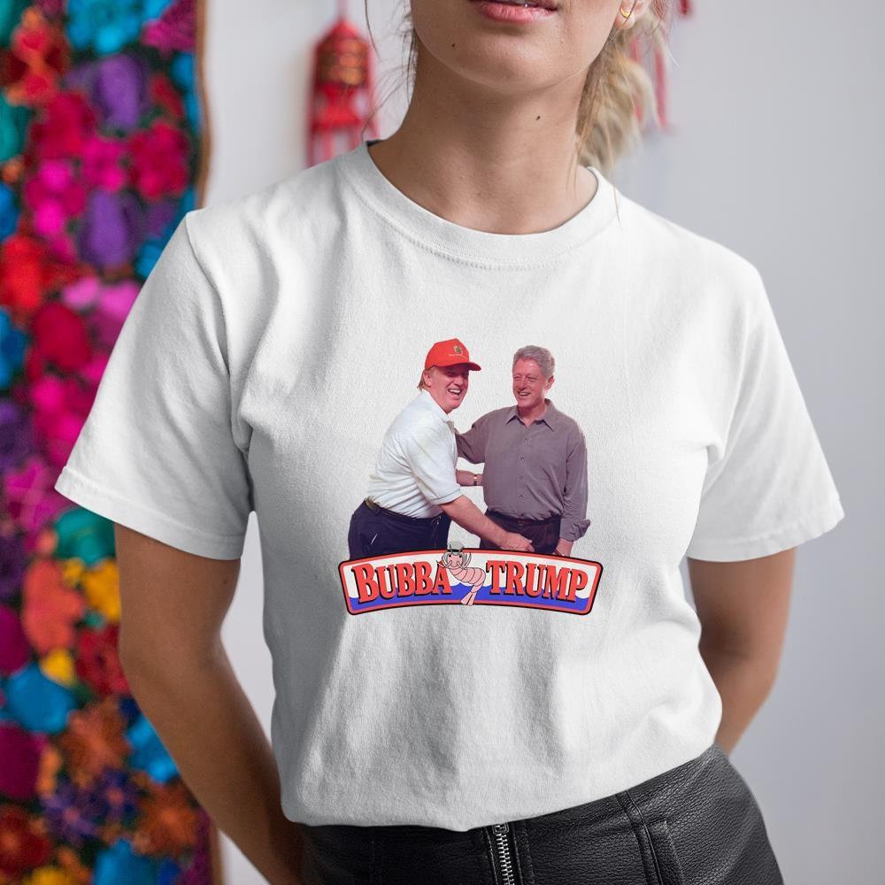 A woman wearing a white shirt with a picture of two men on it.