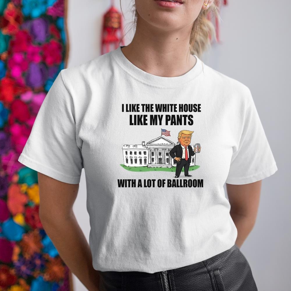 A woman wearing a white shirt that says i like the white house like my pants with a lot of ballroom
