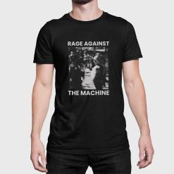 A man wearing a black shirt that says rage against the machine