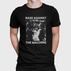 A man wearing a black shirt that says rage against the machine.