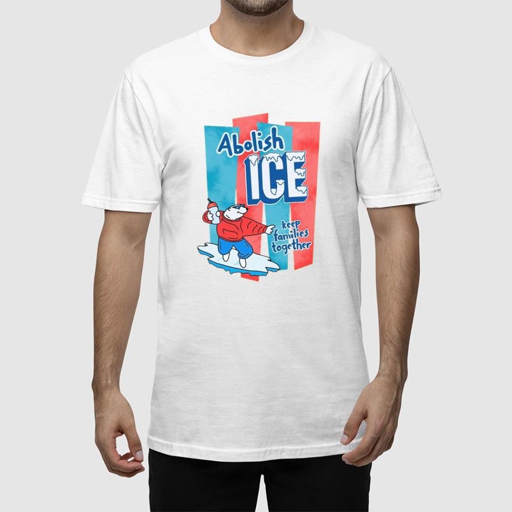 A man wearing a white t-shirt that says abolish ice.