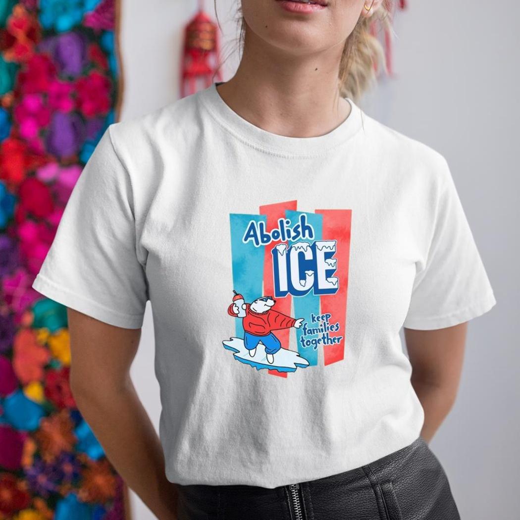 A woman wearing a white shirt that says abolish ice.
