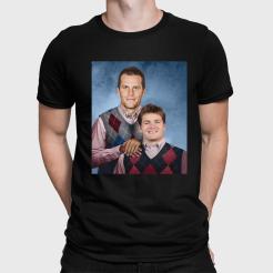 A man wearing a black shirt with a picture of a man and a boy.